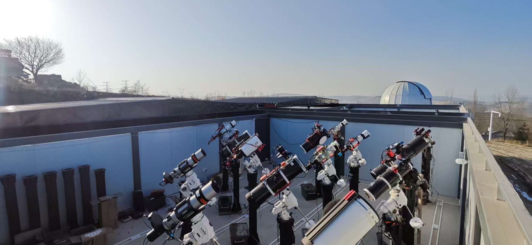 Telescopes on the open roll-off roof of Virgo Observatory